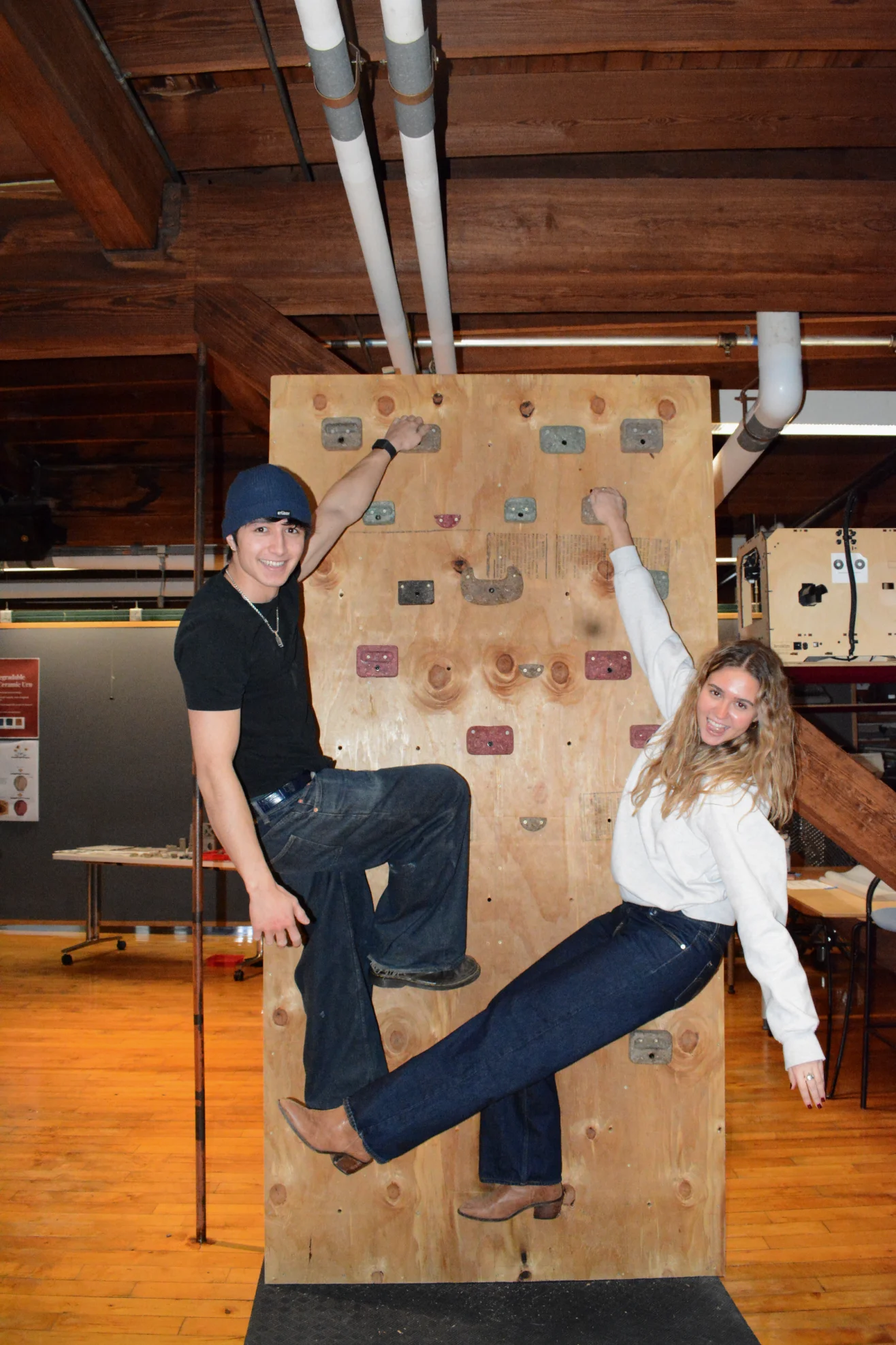 Josh White and Uma Freitag posing on the final wall