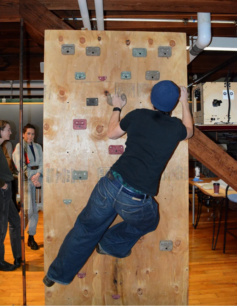 A climber reaching for a hold